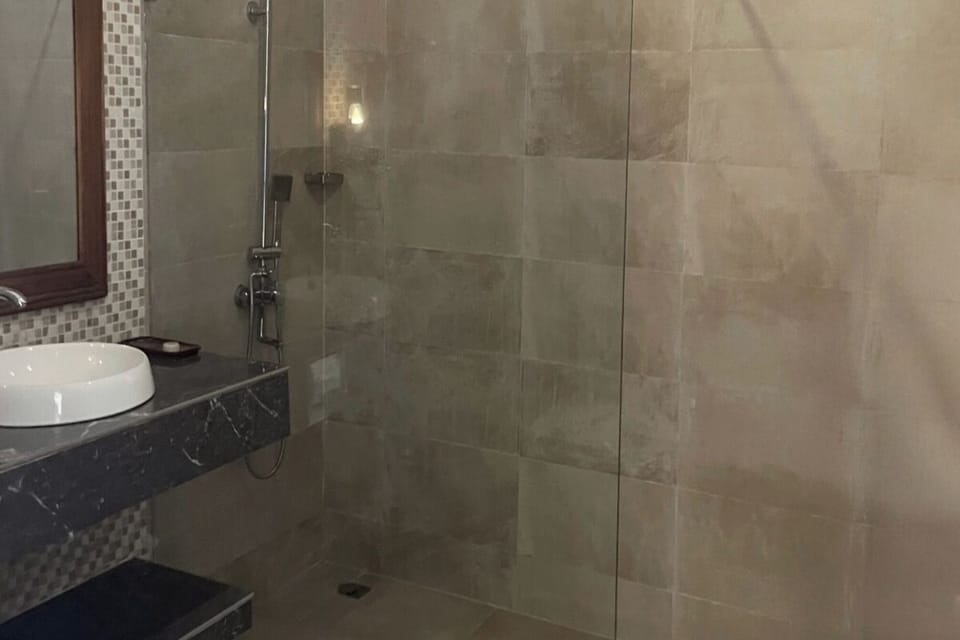 Refresh in a sleek walk-in shower after a sun-soaked day.