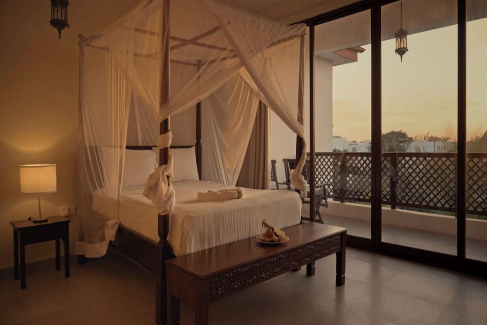 Savor golden-hour calm with a sunset view from bed.