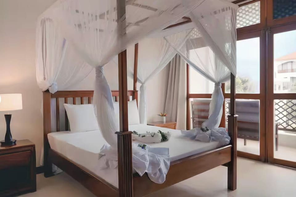 Lounge beneath flowing netting as daylight fills the room.