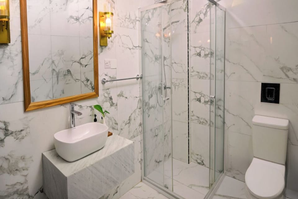 Indulge in a bright marble bathroom for spa-like mornings.