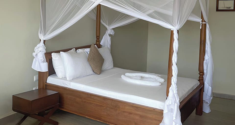 Sink into the dreamy canopy bed for restful nights.