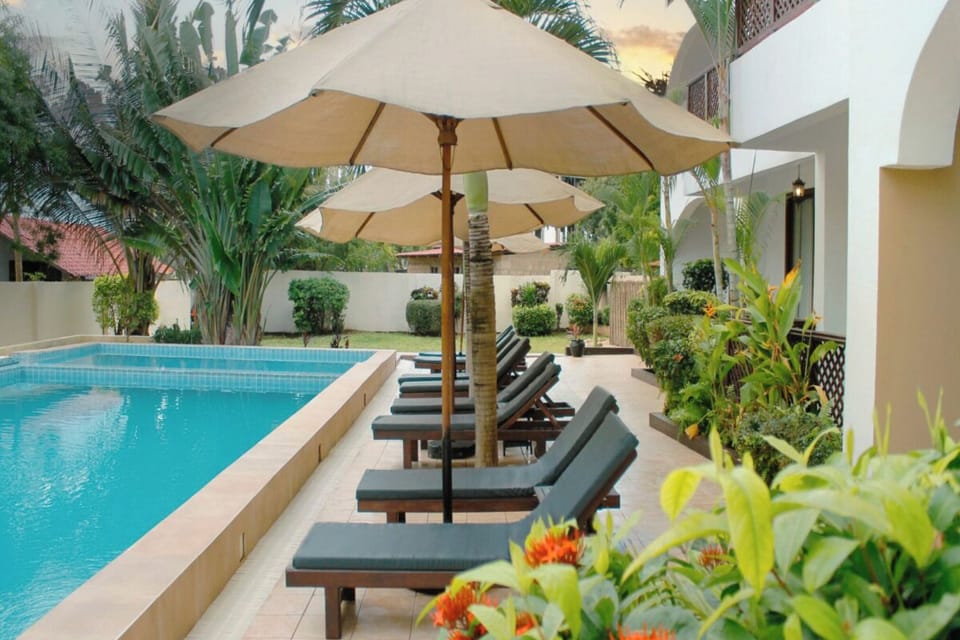 Sip something cool while relaxing along the tranquil poolside.