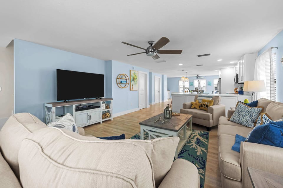 Movie nights sorted. Big screen, deep couches, and an open layout that keeps everyone connected.