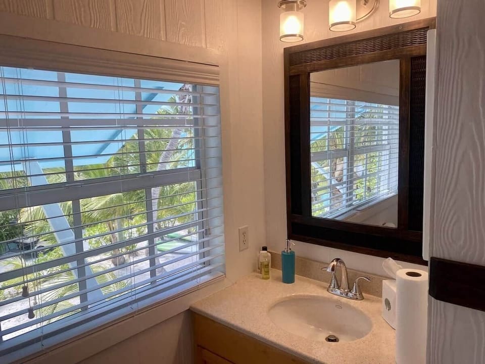 Full bathroom upstairs with shower and tub.