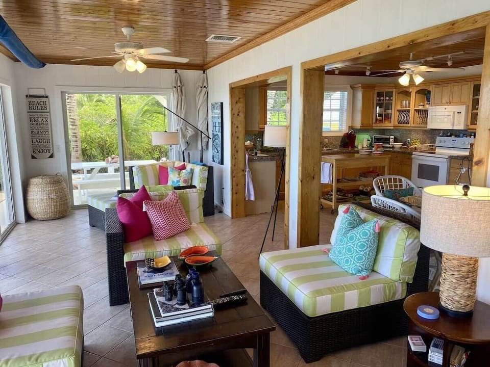 Kitchen and living room area with plenty of seating for the entire family.
