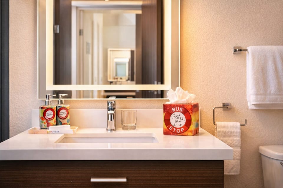 Start the day at a bright vanity with plush towels.