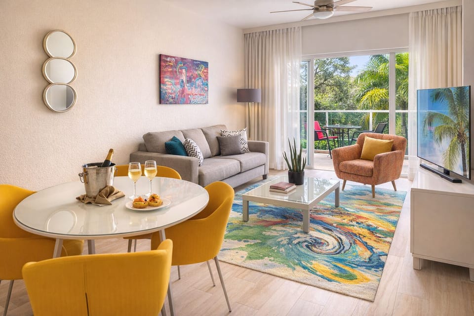 Lounge with sunny balcony views and relaxed, modern comfort.