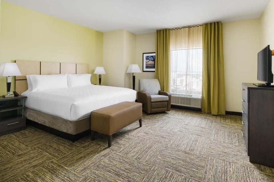 Stretch out and enjoy extra space in this calming king room.