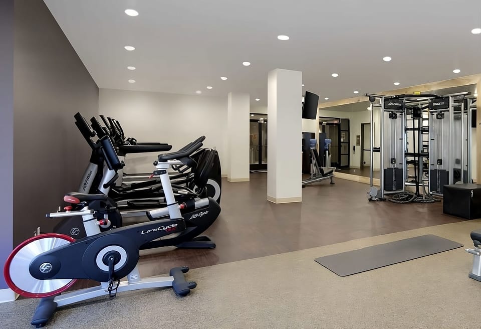 Energize your morning with a bright, fully equipped fitness studio.