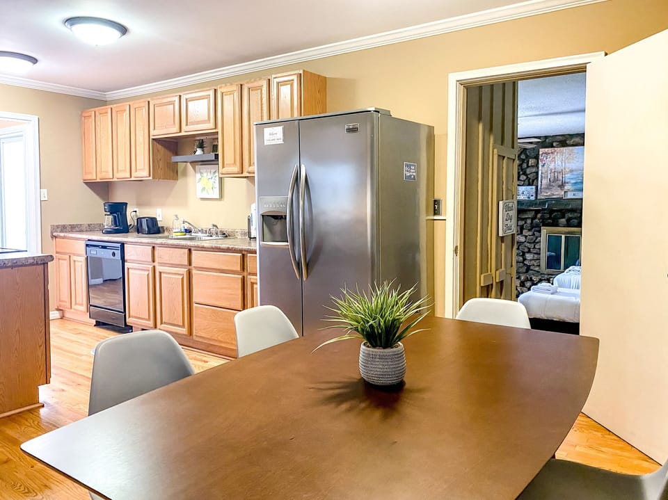 The dining table invites you to slow down and enjoy meals together, with seating for six that makes gathering simple and comfortable. Its placement keeps the flow natural, making it easy to move from cooking to dining without missing a moment.