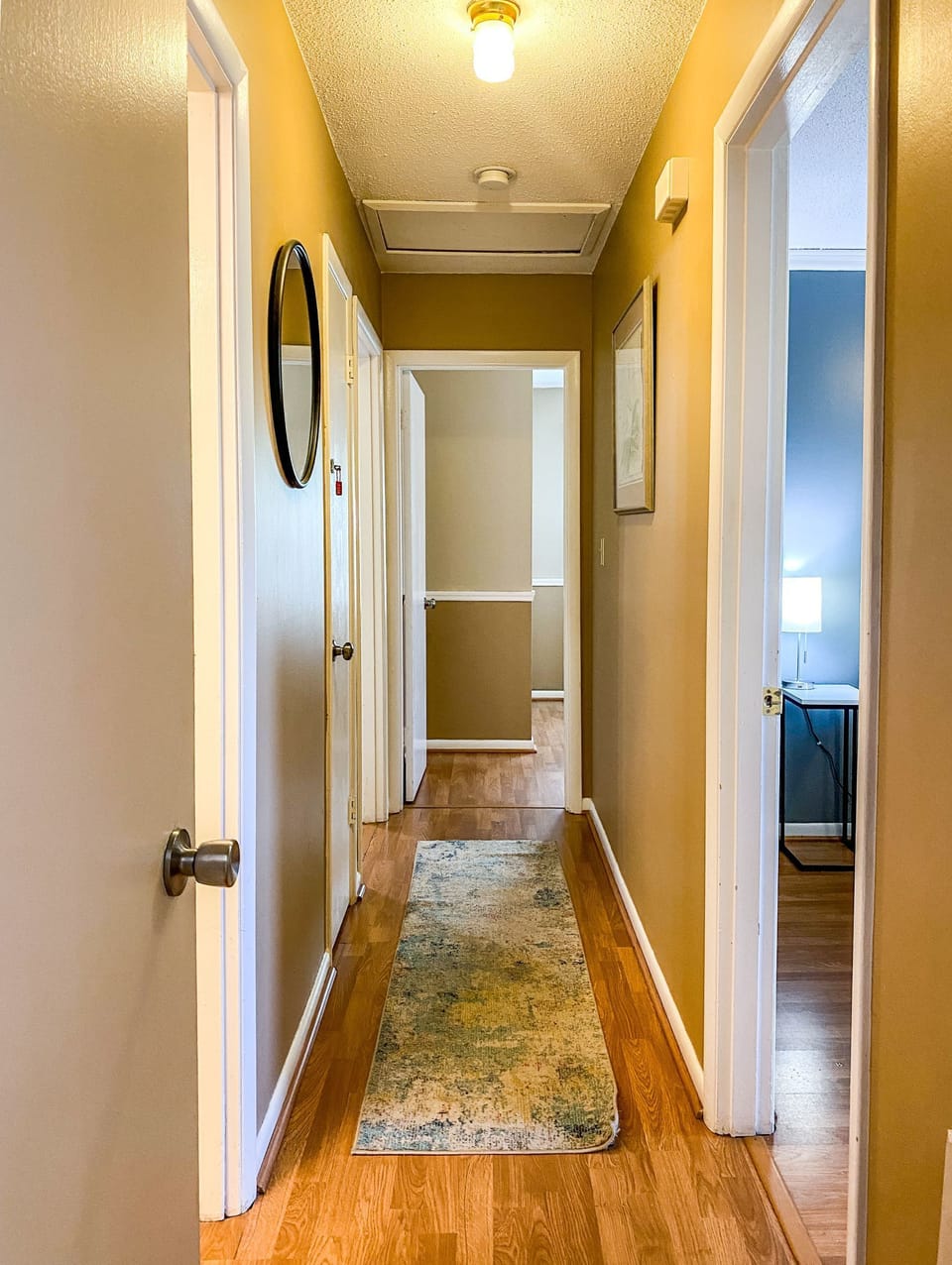 The hallway connects each space with a clean, open feel that keeps the home easy to navigate. It ties everything together naturally, making it simple to move between rooms while maintaining a sense of flow and continuity throughout.