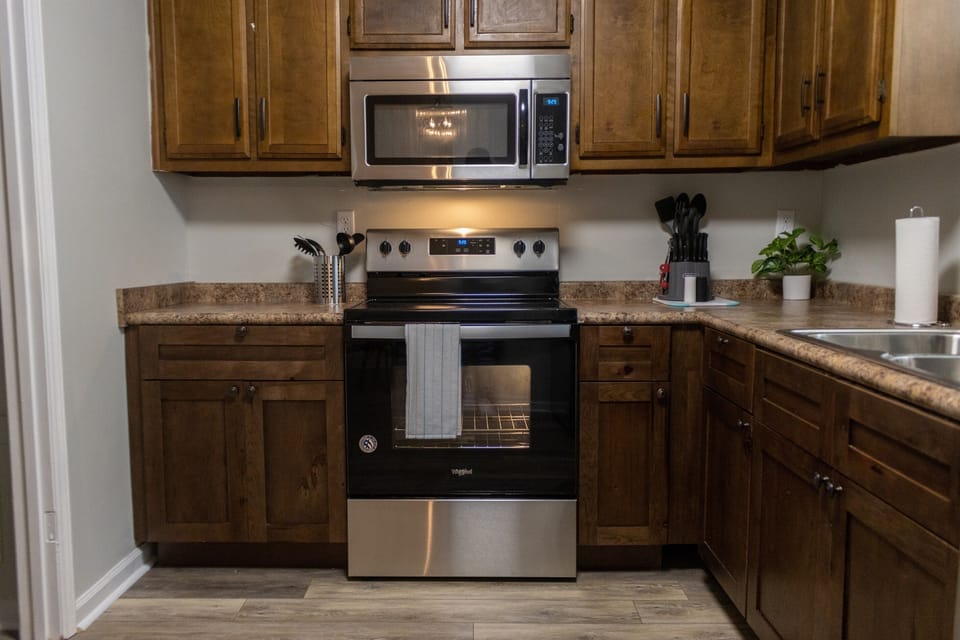 The kitchen is fully equipped with everything you need, from full-size appliances to everyday essentials, making it easy to cook, snack, or settle into your routine.