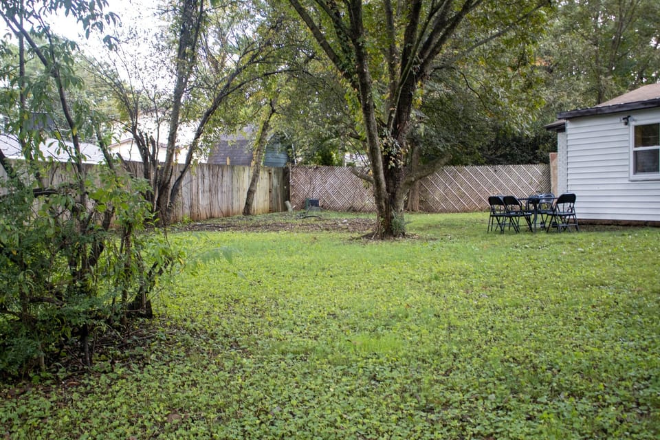 Step outside and take in the full yard, where there’s plenty of space to spread out, gather together, or enjoy a quiet moment away from the day.