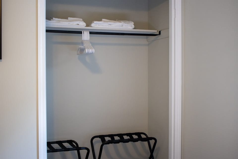 The closet in this room provides convenient storage, making it simple to unpack, organize, and feel at home during your stay.