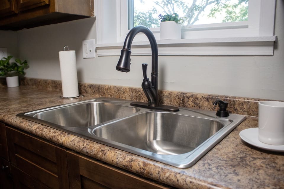 Clean fixtures make it easy to cook and clean in this fully stocked kitchen. Prepared with everything you need for a comfortable stay.