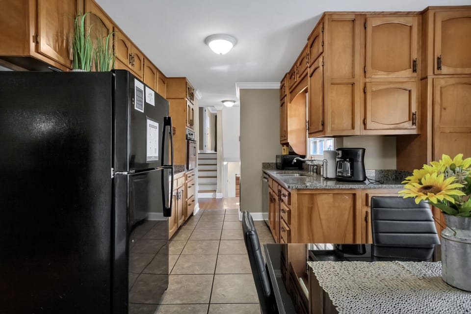 Cook with ease in this fully equipped kitchen featuring modern appliances, ample counter space, and everything you need to prepare meals at home.