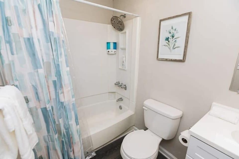 Enjoy the convenience of a private bathroom in the king suite, complete with a tub and shower combination and everything you need for a comfortable stay.