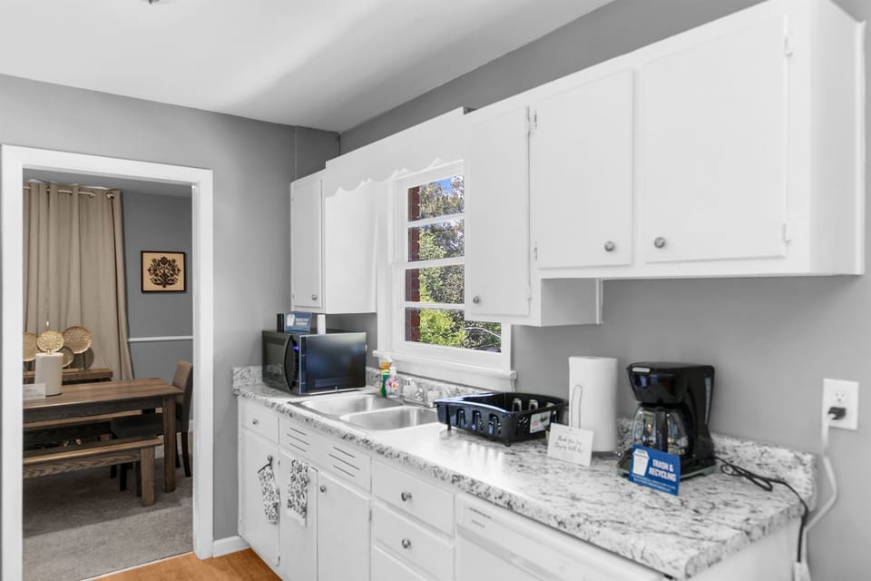 Bright and functional, the kitchen in Unit A makes it easy to prep, serve, and stay connected with the rest of the space.
