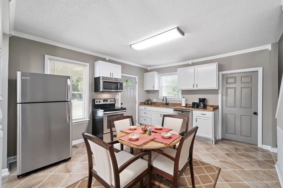 The kitchen is compact yet fully equipped, giving you everything you need to cook, prep, and enjoy meals during your stay.