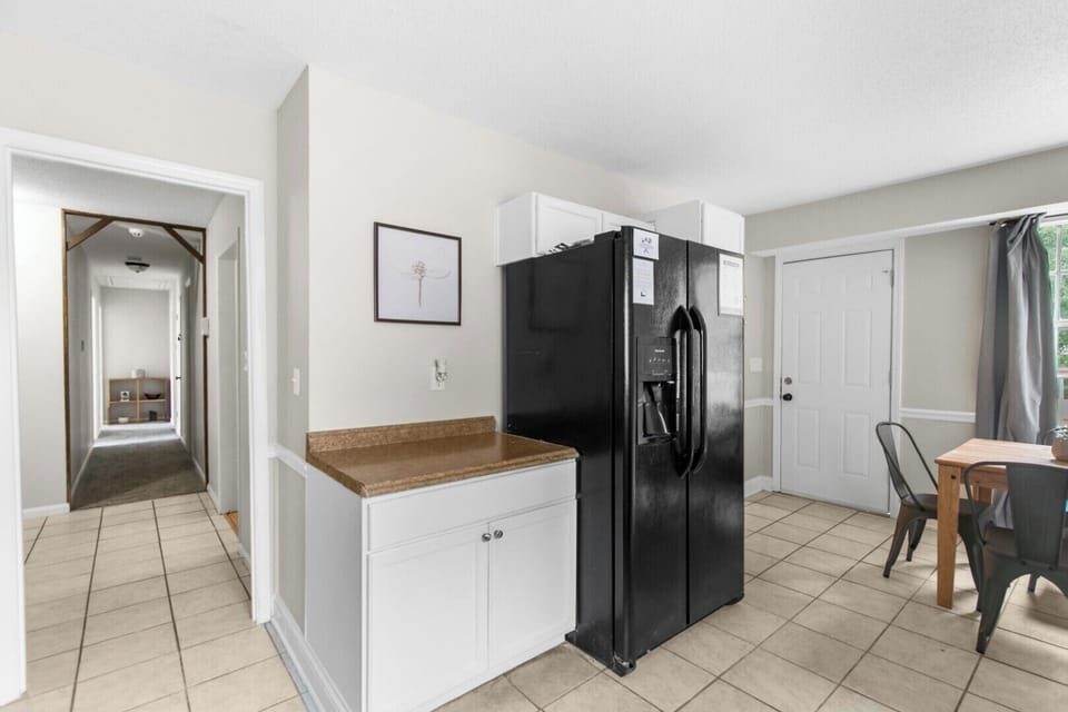 Tucked into the kitchen area, the dining table for four creates a natural place to pause, eat, and connect—right in the heart of the home.