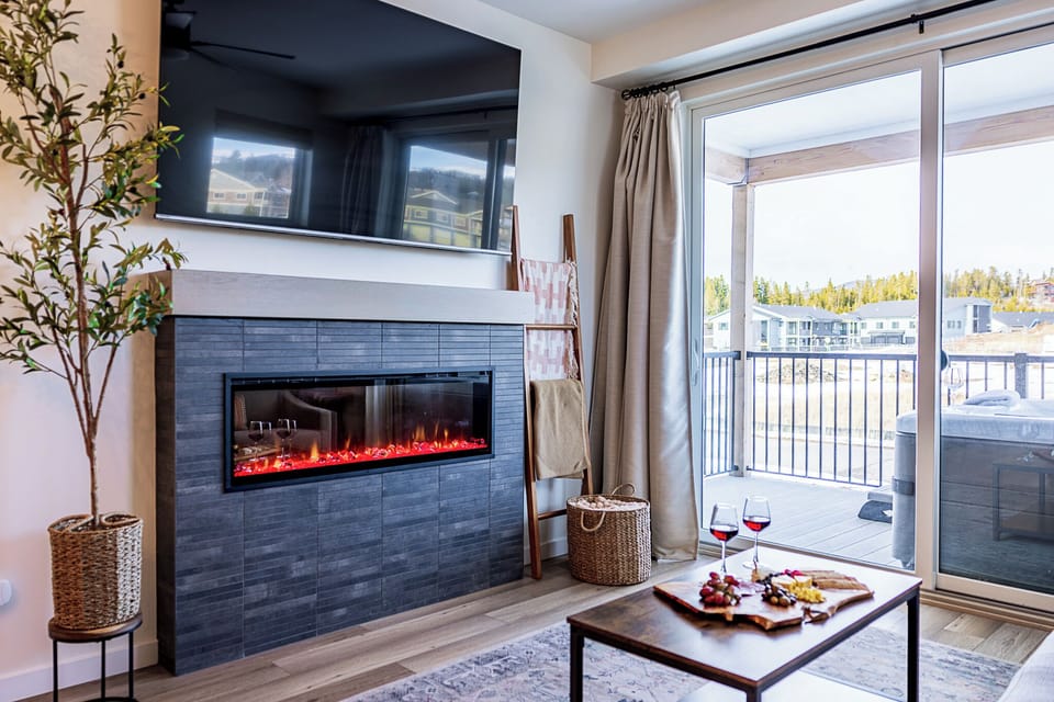 Living Room Retreat: Bright space with a sleek fireplace, perfect for unwinding after adventures!