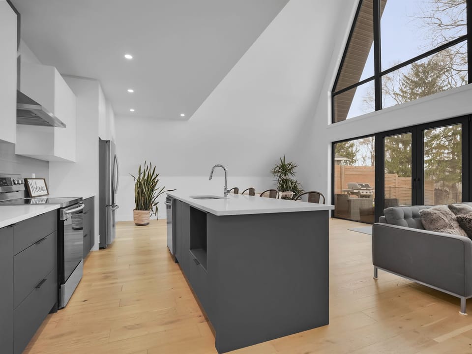     “Bright, open living space with floor-to-ceiling windows”
