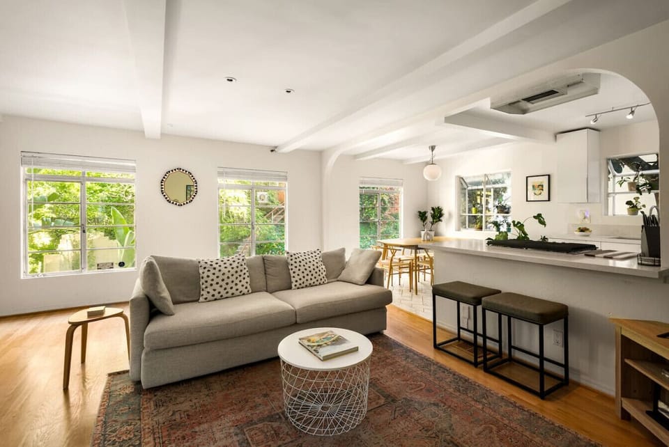 Sunlit living area designed for comfort, featuring scenic views and a cozy, elevated feel.