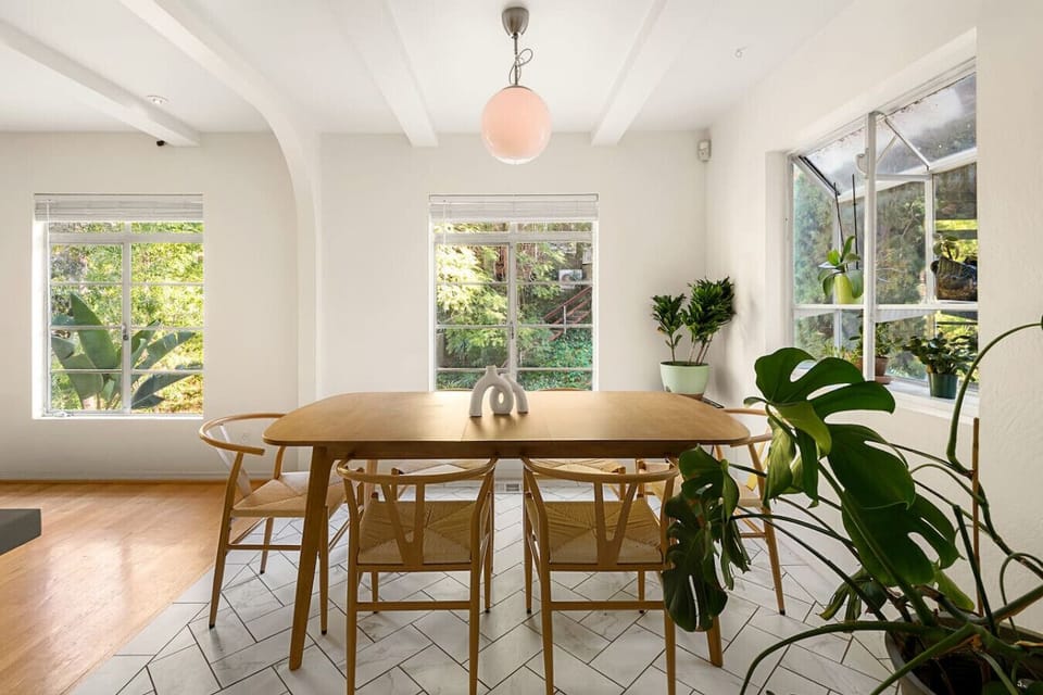 Light-filled dining nook with a welcoming table setting and easy flow from the kitchen