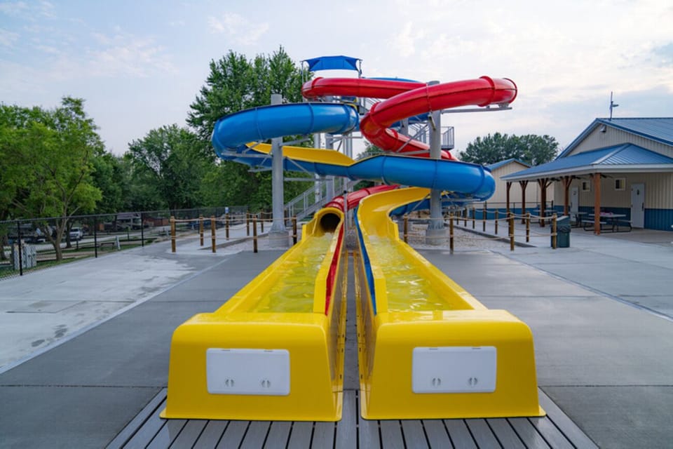 Glide through sweeping turns on the double water slides.