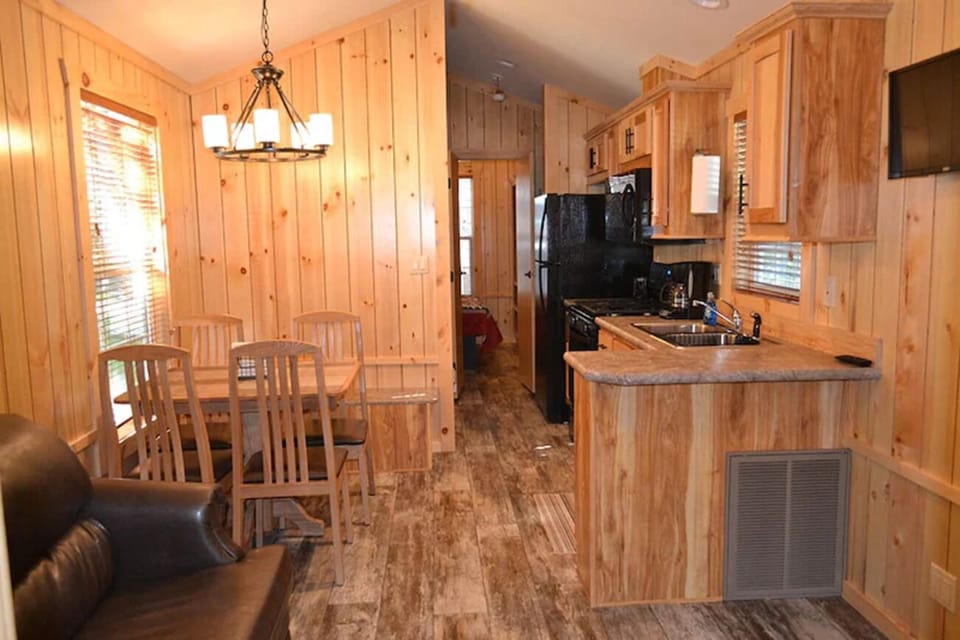 Sip coffee at the dining table in a sunny, rustic interior.