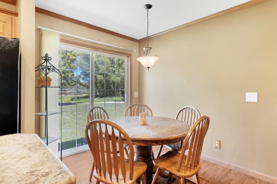 Enjoy sunny meals by the sliding doors with backyard views.