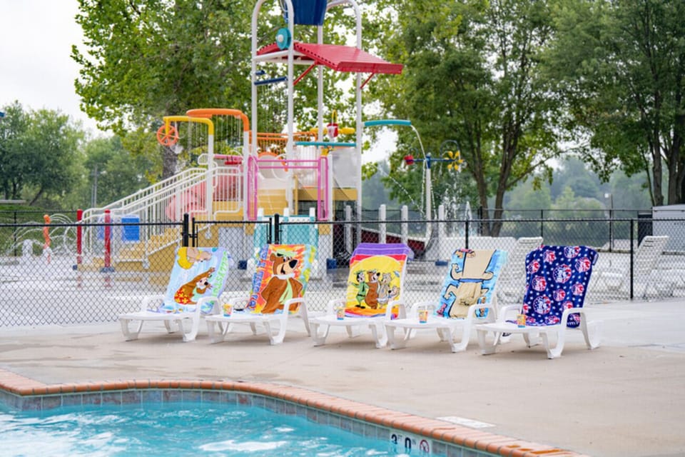 Relax on loungers while kids play in splashes.