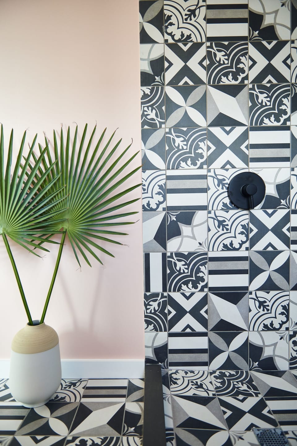 Rinse off beneath statement tiles that feel boutique and playful.