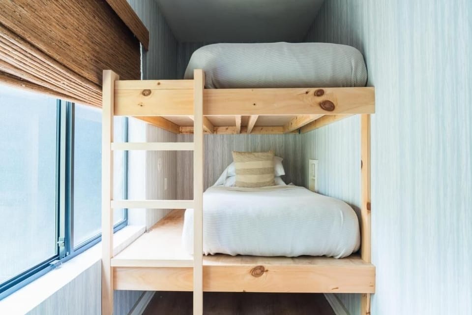 Tuck in the kids with snug bunks beside the window.