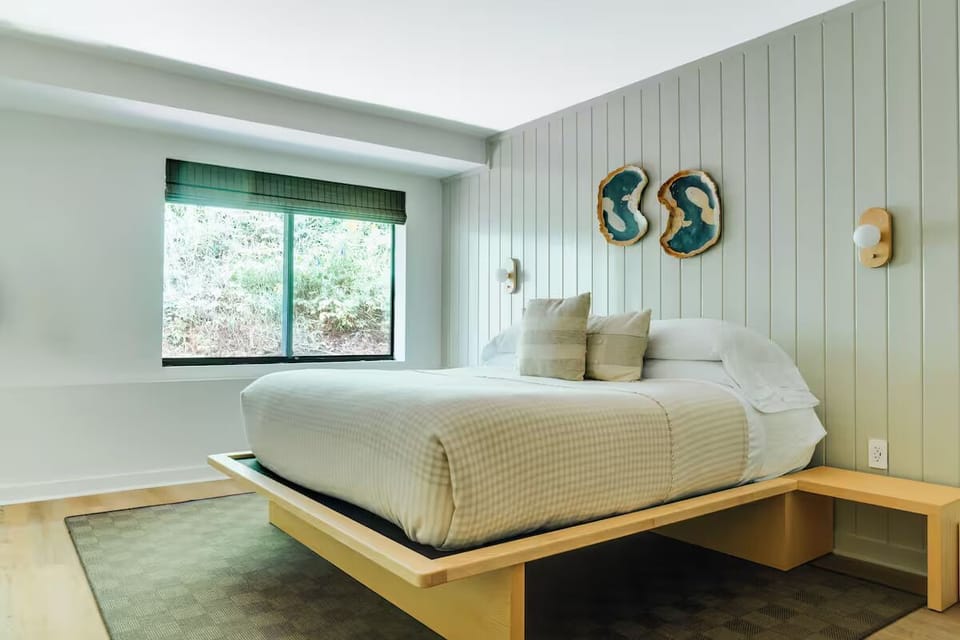 Unwind in crisp linens and calming, modern cottage styling.