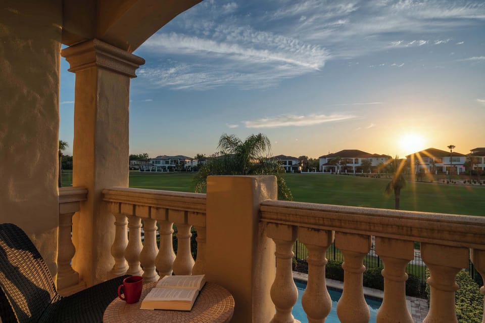 Covered balcony w/ columns & seating, a relaxing spot to enjoy the view