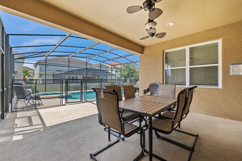 Covered Patio w/ Outdoor Dining and Pool View