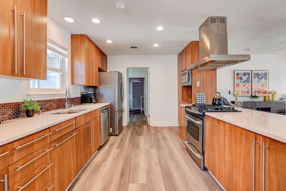 Gourmet kitchen with stainless steel appliances and modern upscale extras