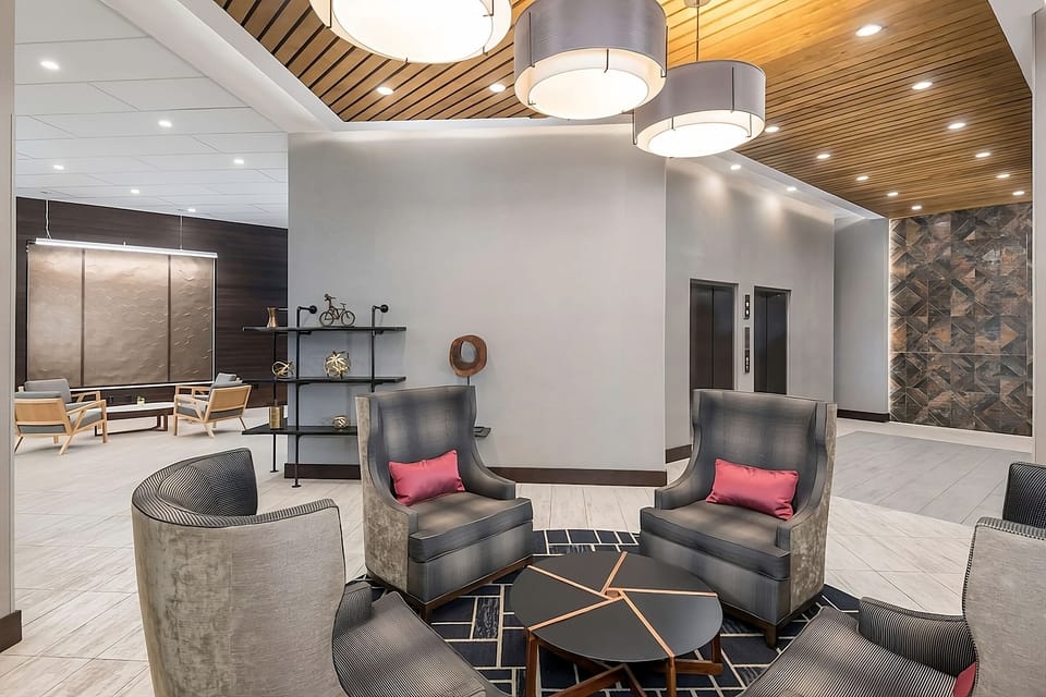 Relax beneath warm lighting in a contemporary lounge setting.