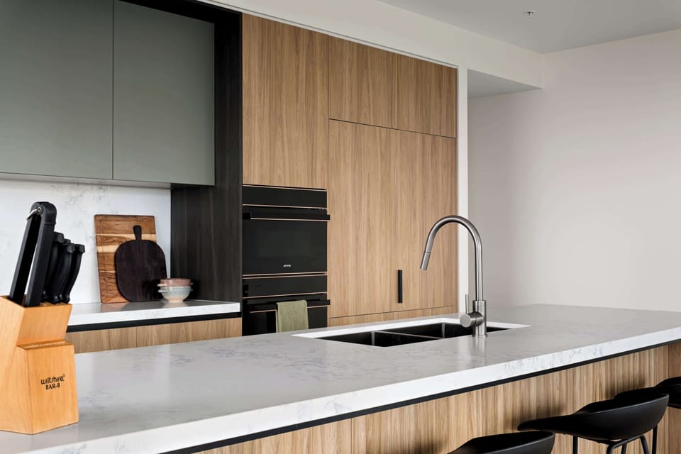 Modern, fully equipped kitchen with island seating-designed for everyday ease/entertaining. Featuring pod coffee machine, double-door fridge/freezer, sandwich press, blender, plus all the essentials you need to cook, gather & enjoy meals w loved ones