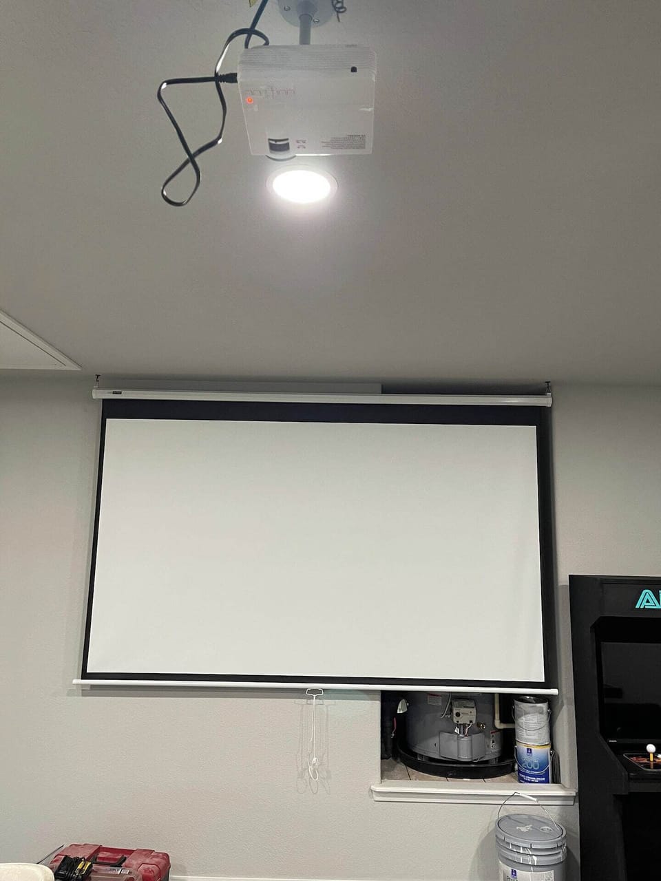 A large projection screen to stream movies from your phone or computer and watch in the game room.