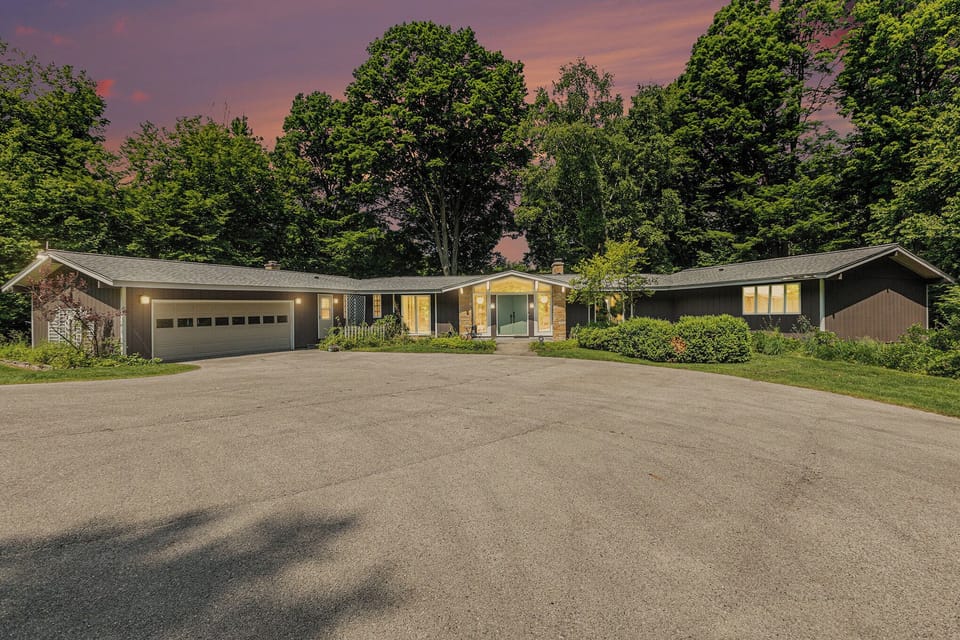 EXTERIOR:  The front of the home at dusk