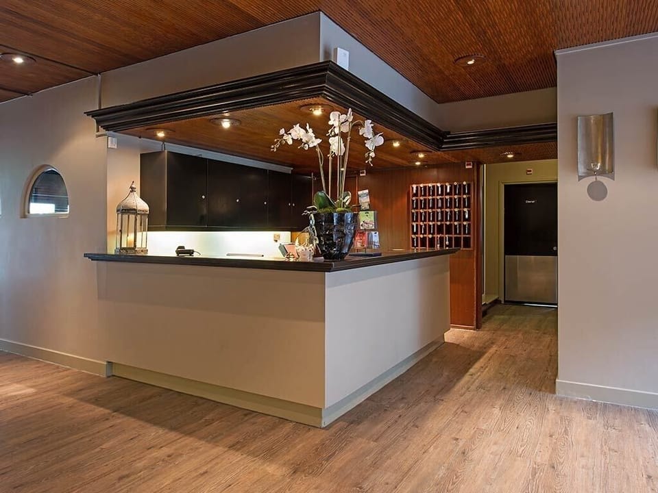 Arrive with ease at a sleek, welcoming reception desk.