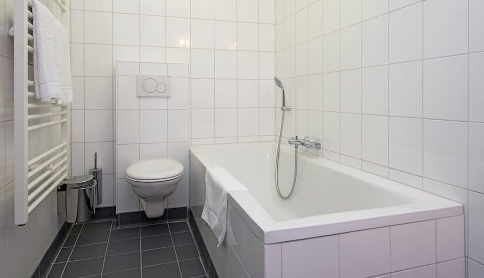 Refresh with a deep soak in the clean, tiled bathtub