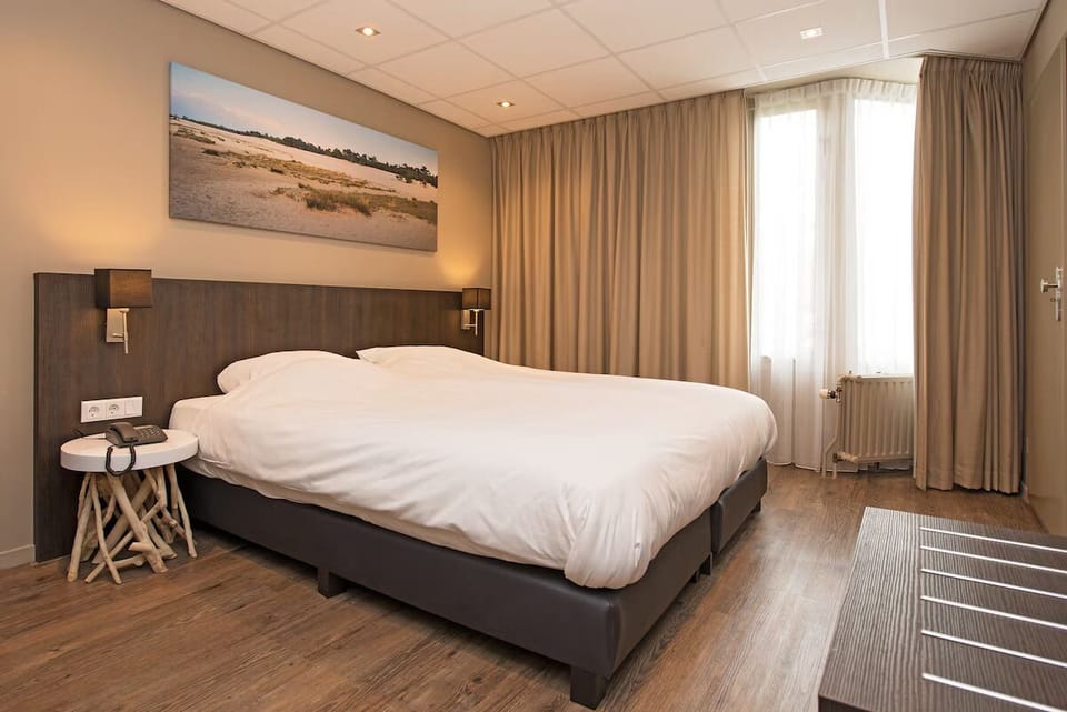 Relax into plush bedding in this warm, inviting double room.