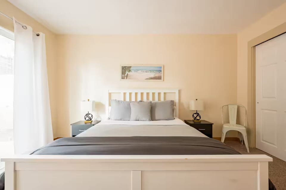 Bedroom with small deck outside.