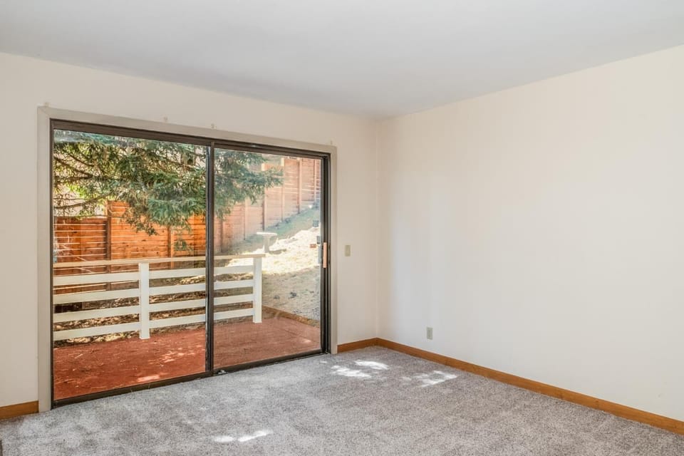 Small deck outside bedroom #2. Room is furnished w/blackout curtains.