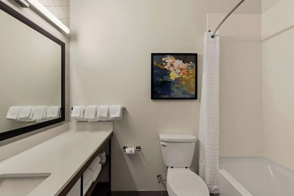 Refresh after adventures in a bright bath with plush towels.