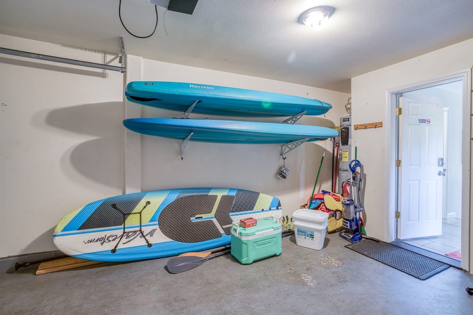 Adventure Hub: Gear up for lake fun with two kayaks and a paddleboard!