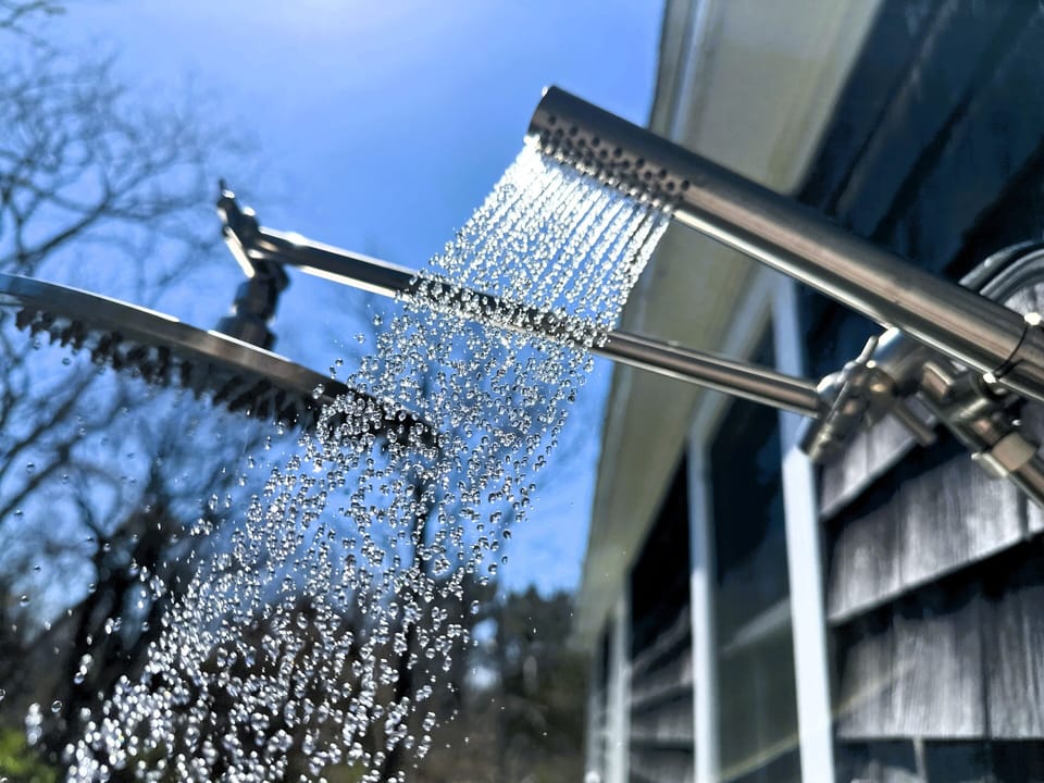 Rain shower head with wand